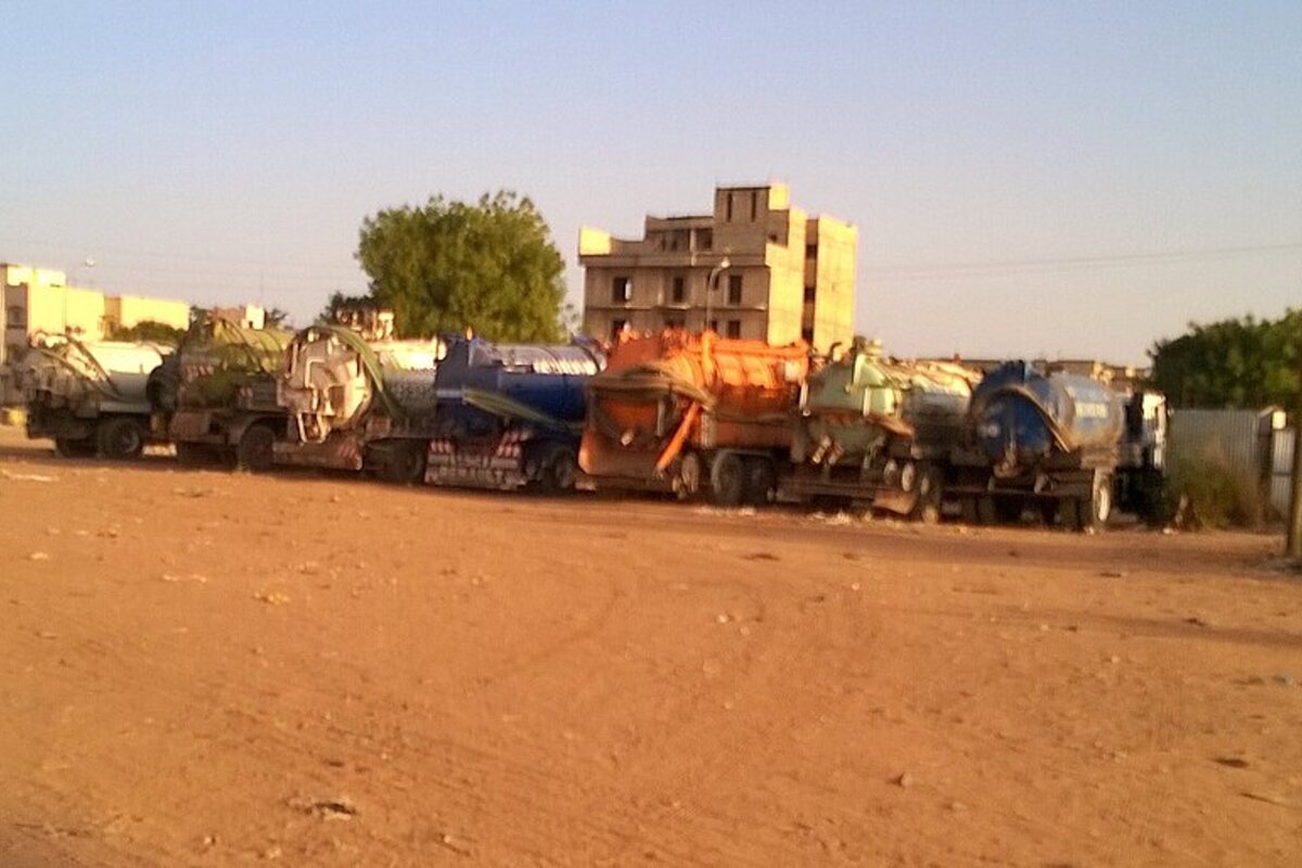 Septic pump truck parked on a rural roadside service route