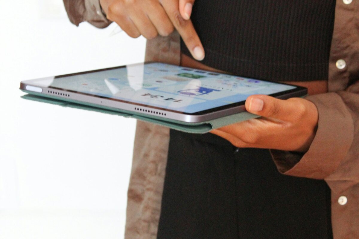 Person entering inspection notes on a tablet device
