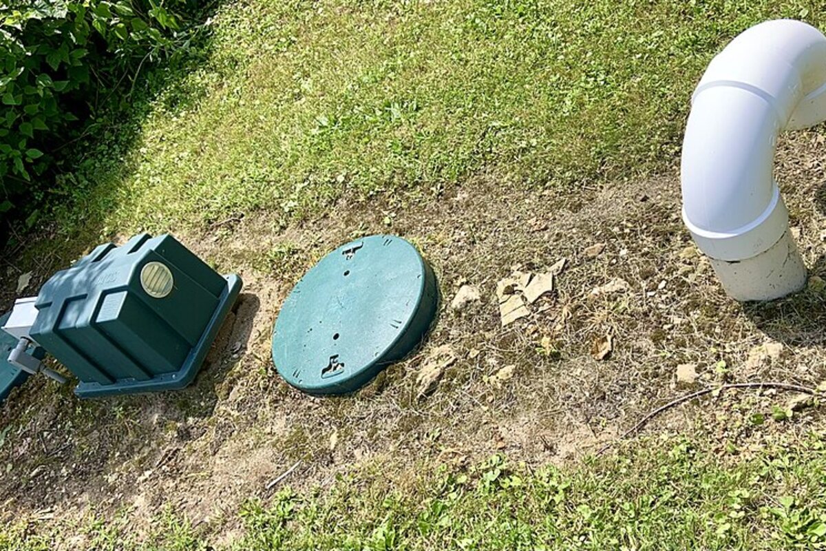 Aerobic septic components and lids installed in a residential yard